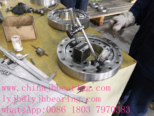 China girando rodamiento fábrica de oferta 013.32.1405 rodamiento giratorio de bolas de cuatro puntos de contacto,15253X1235X119mm proveedor