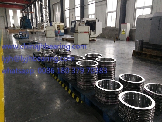 Es el RKS.060.25.1204 rodamiento de bolas de cuatro puntos de contacto de fábrica china, 1119x1289x68mm, sin engranajes, estándar JBT10471 proveedor