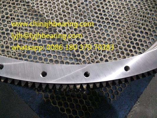 Es el RKS.060.25.1204 rodamiento de bolas de cuatro puntos de contacto de fábrica china, 1119x1289x68mm, sin engranajes, estándar JBT10471 proveedor